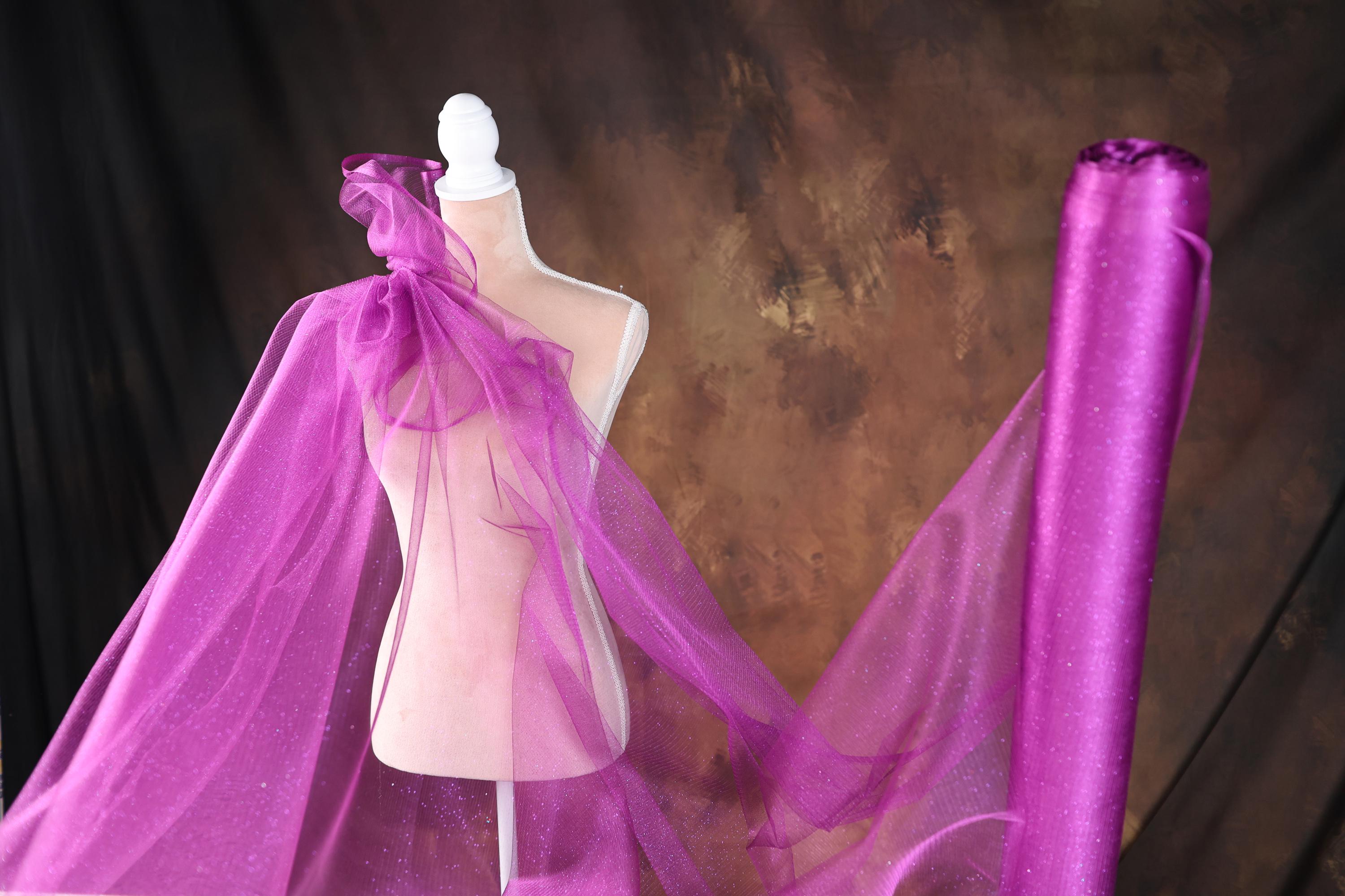 a mannequin with a purple veil on it