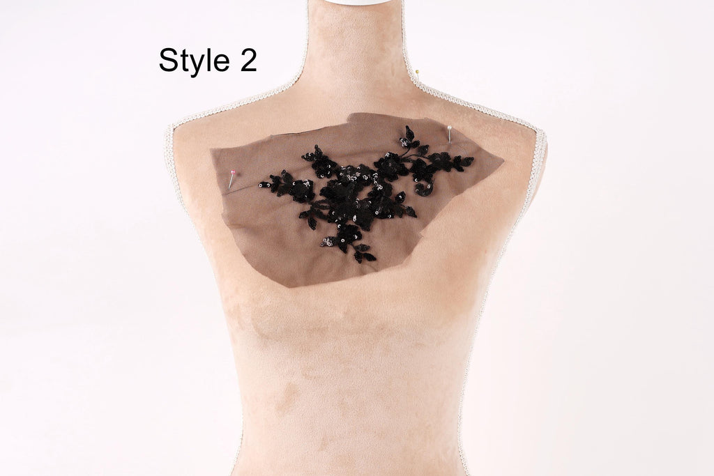 A mannequin with a piece of fabric on its chest, featuring a floral pattern.