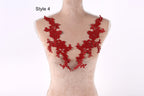 A mannequin wearing a red lace vest with a floral pattern.