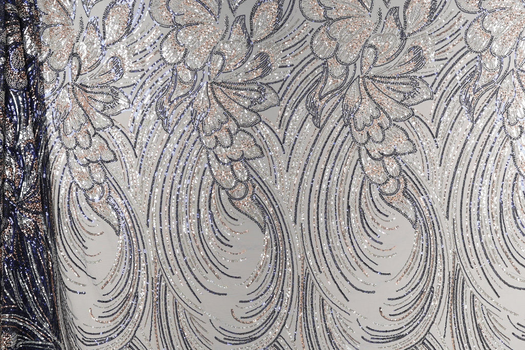 a close-up view of a fabric with a repeating pattern of silver and black lines, creating a visually striking and intricate design.