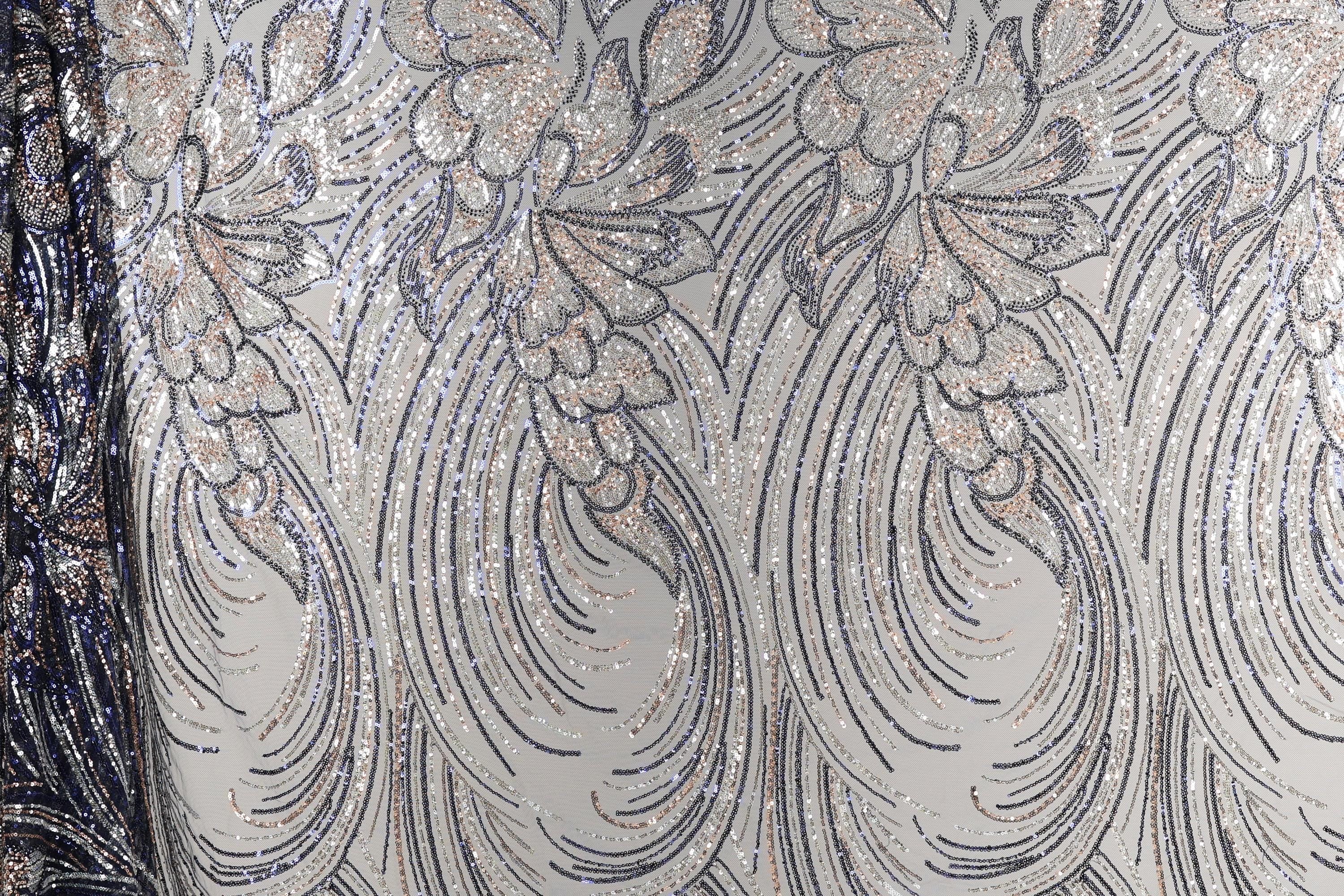 a close-up view of a fabric with a repeating pattern of silver and black lines, creating a visually striking and intricate design.