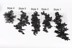 five different black lace pieces with various styles, arranged on a white background.
