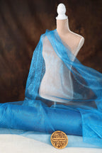 a close up of a mannequin wearing a blue scarf
