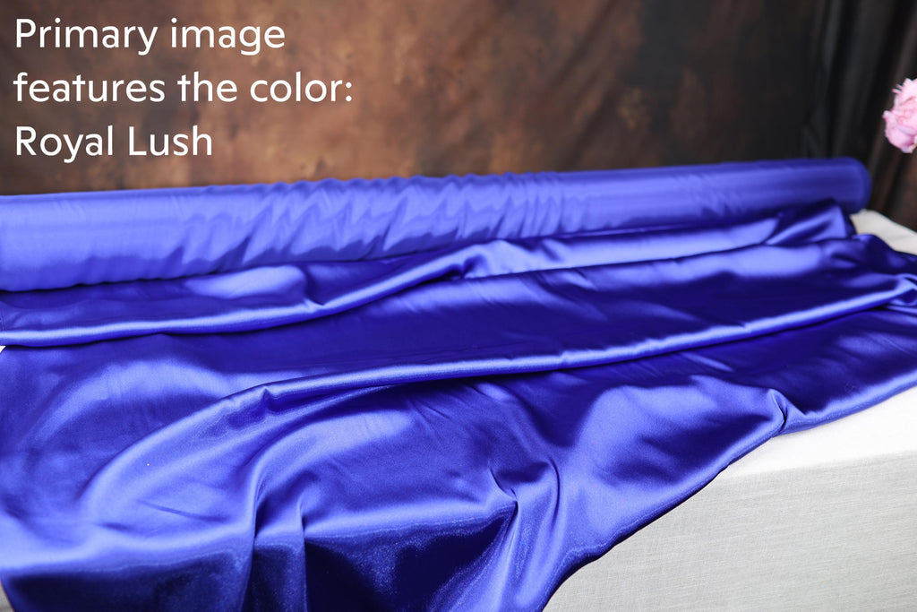 a roll of blue satin fabric, which appears to be a material used for clothing or other textile products.