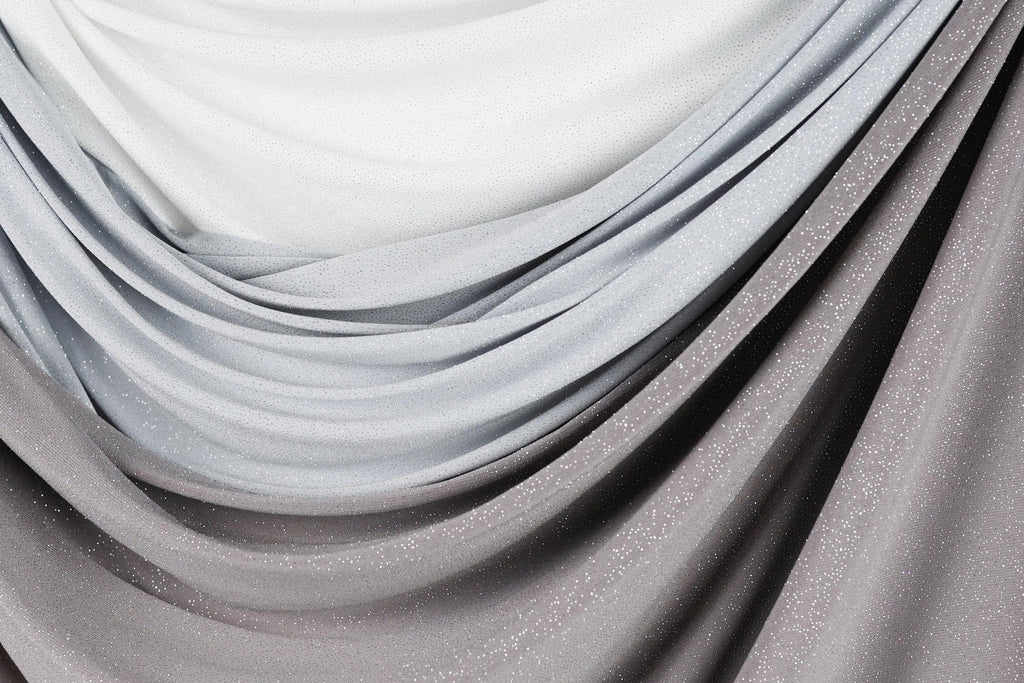 a close-up view of a fabric with a gradient of gray and white colors, creating a visually appealing and textured appearance.
