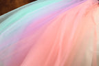 a woman in a dress with a colorful skirt