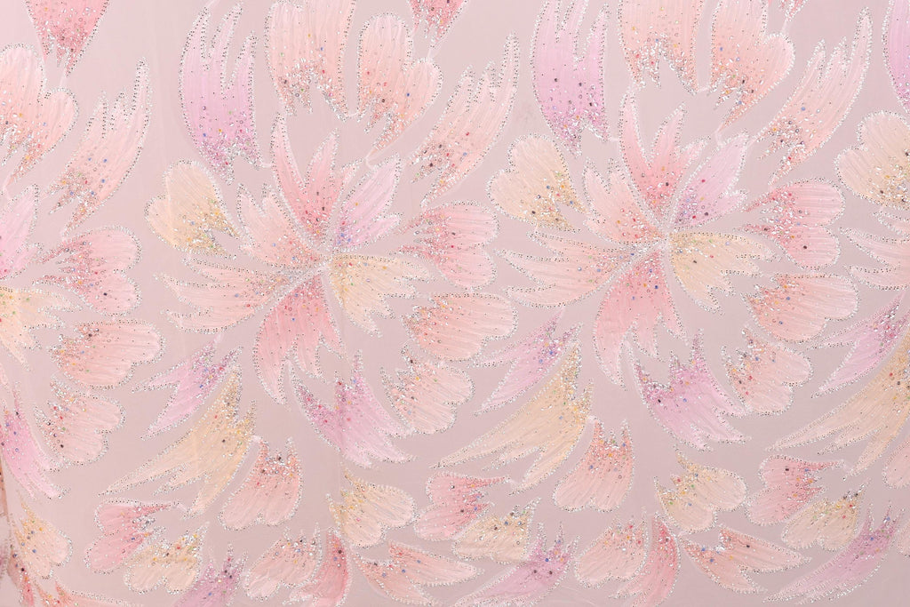 a pattern of pink and yellow flowers with glittering details, creating a visually striking and vibrant design.