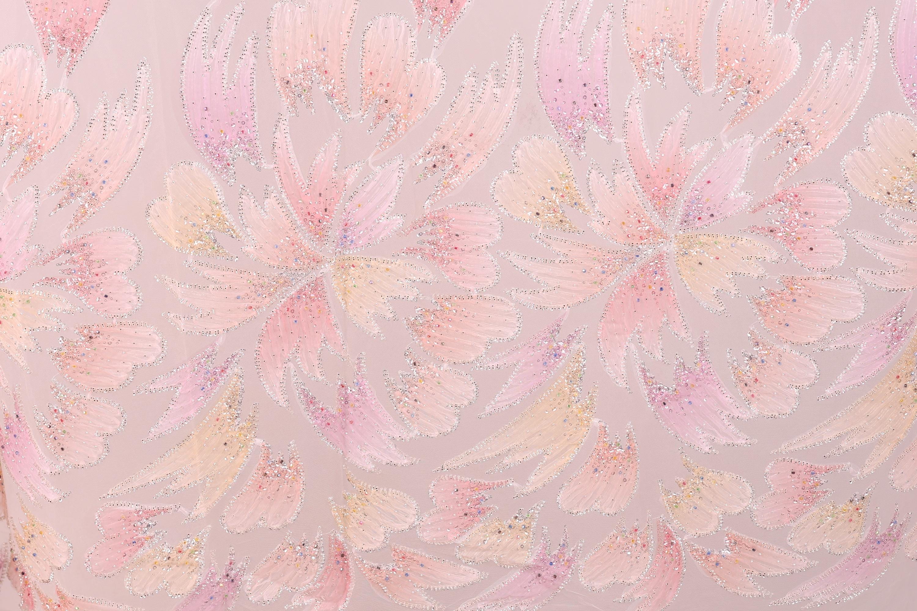 a pattern of pink and yellow flowers with glittering details, creating a visually striking and vibrant design.