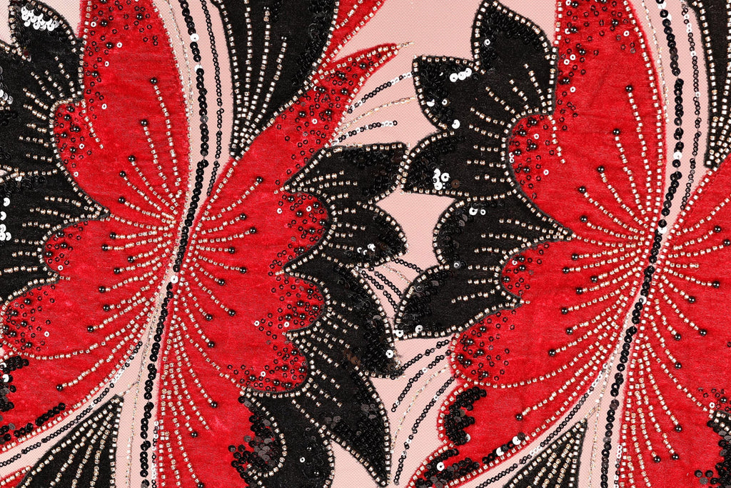 a close-up view of a fabric with a striking pattern of red and black butterflies. The butterflies are intricately designed with sequins and beads, creating a visually captivating and detailed design.