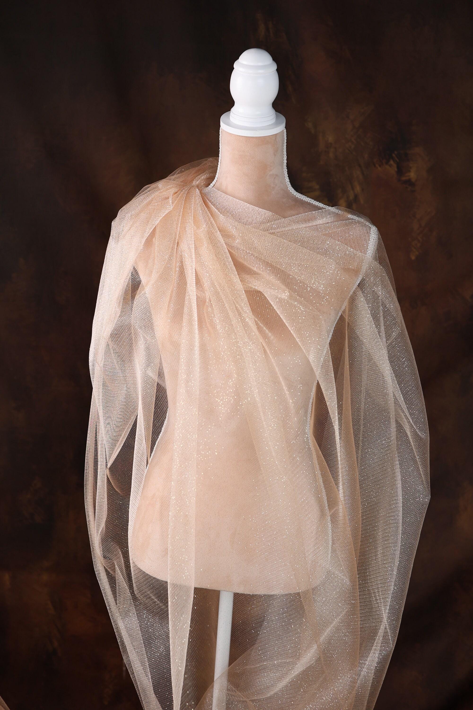 a mannequin with a veil on top of it