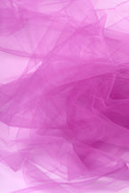 The image is a close-up of a soft, flowing fabric in a vibrant shade of pink. The fabric appears to be made of sheer material, giving it a delicate and ethereal appearance. The image does not contain any discernible objects or text, and the focus is solely on the fabric's texture and color.