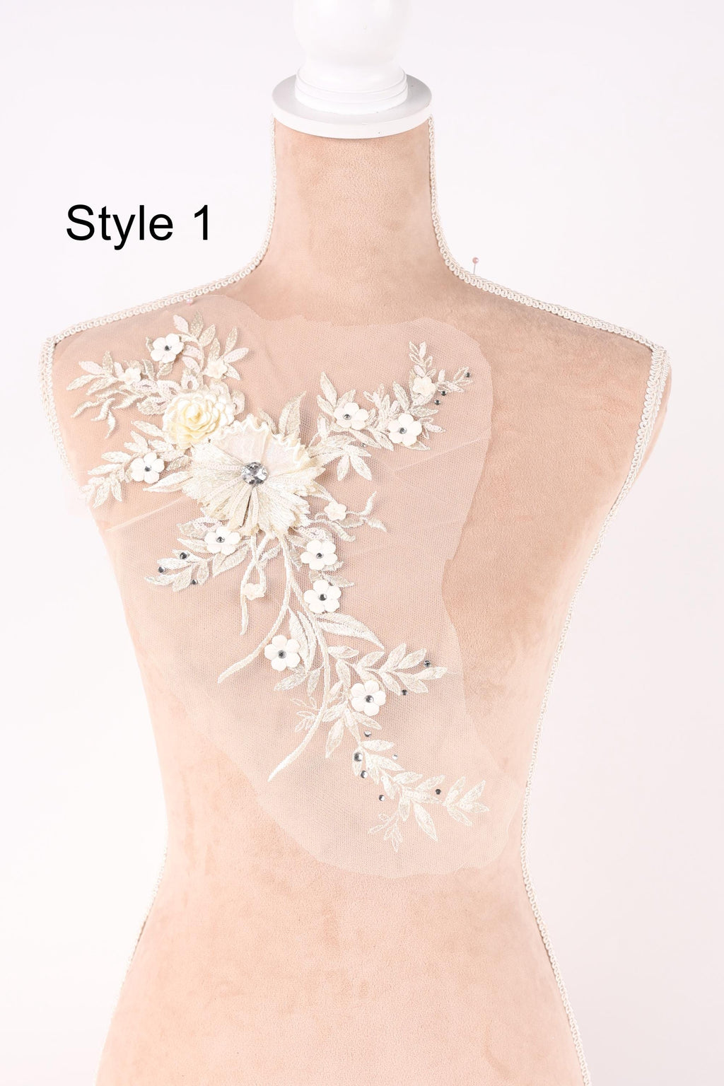 A mannequin with a delicate floral embroidered on its bust, showcasing a variety of styles.