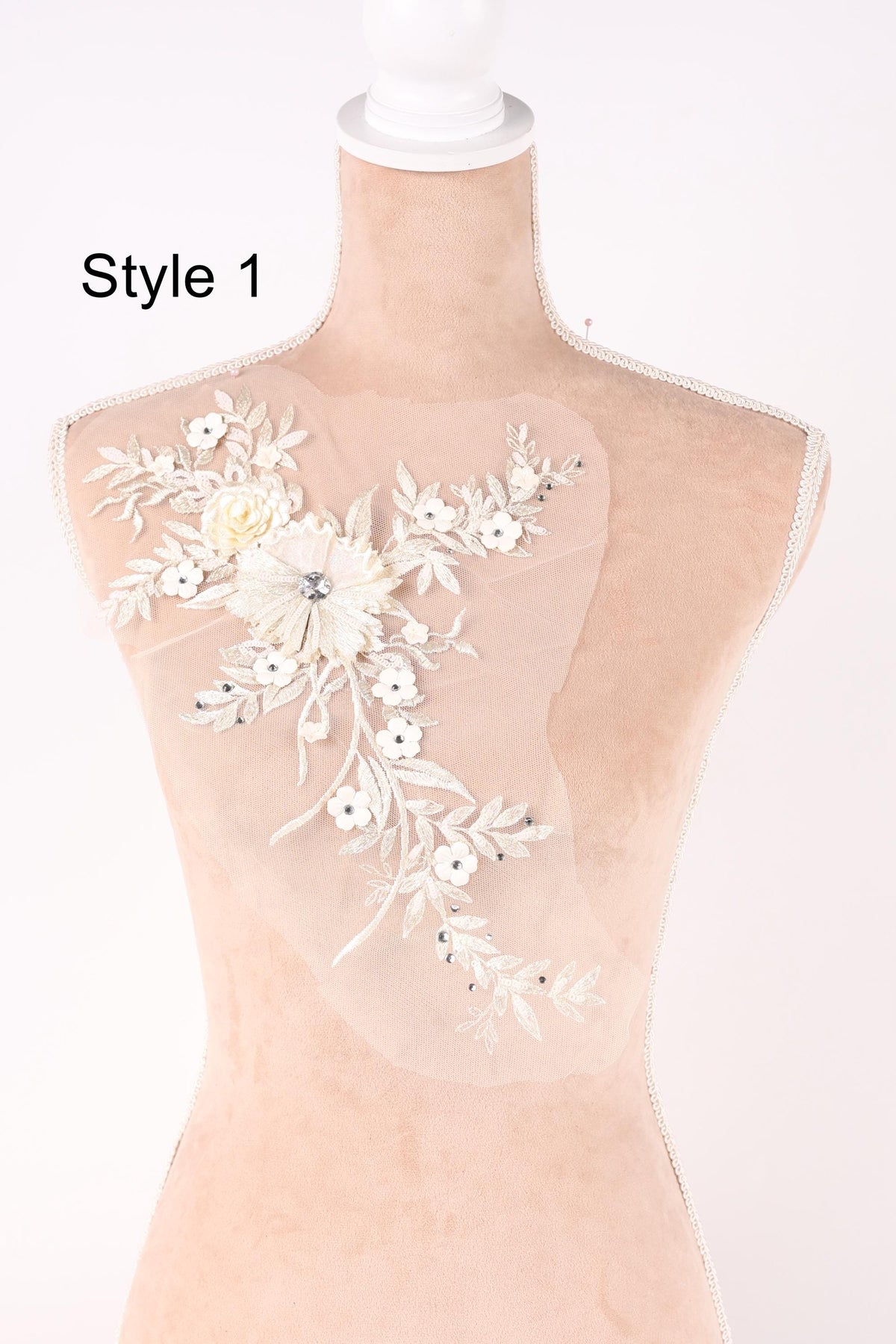 A mannequin with a delicate floral embroidered on its bust, showcasing a variety of styles.