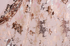 The image is a close-up of a fabric with a metallic, sequined pattern in shades of pink, brown, and gold. The fabric appears to be a sheer or sheer-like material, with a textured and shiny appearance.