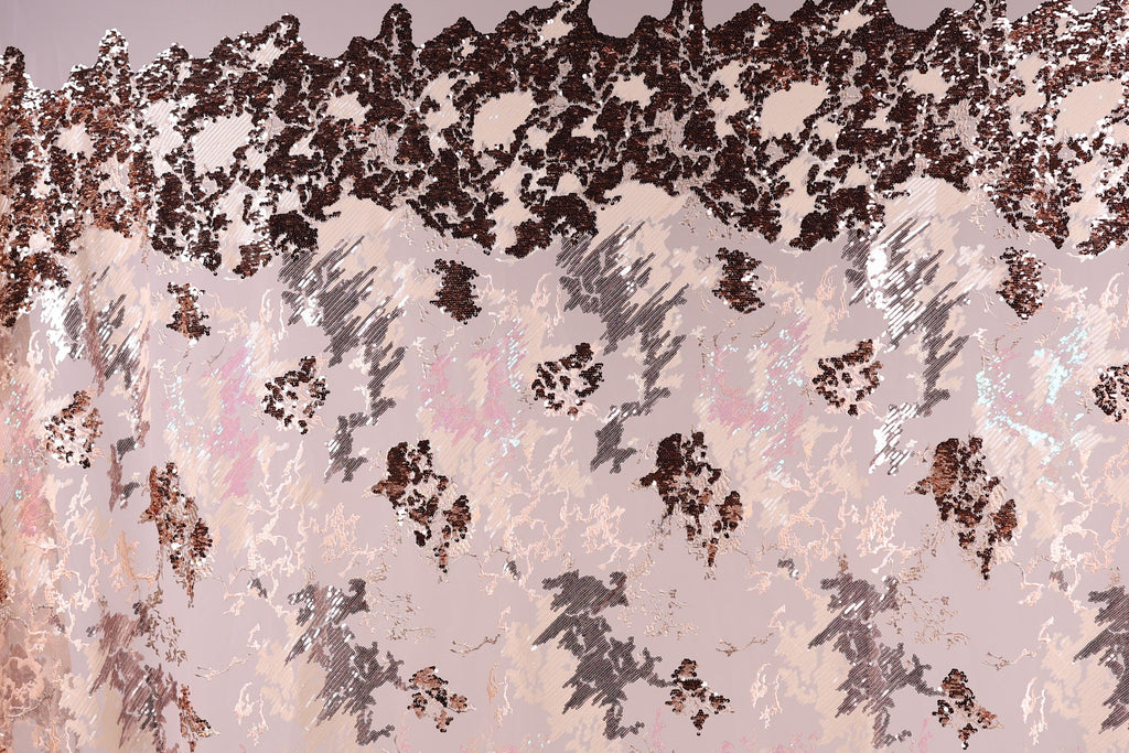 The image is a collage of various textures and patterns, including a mix of pink, black, and white colors. The collage appears to be a creative and artistic representation of different elements coming together to form a visually interesting composition.