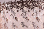 The image is a collage of various textures and patterns, including a mix of pink, black, and white colors. The collage appears to be a creative and artistic representation of different elements coming together to form a visually interesting composition.