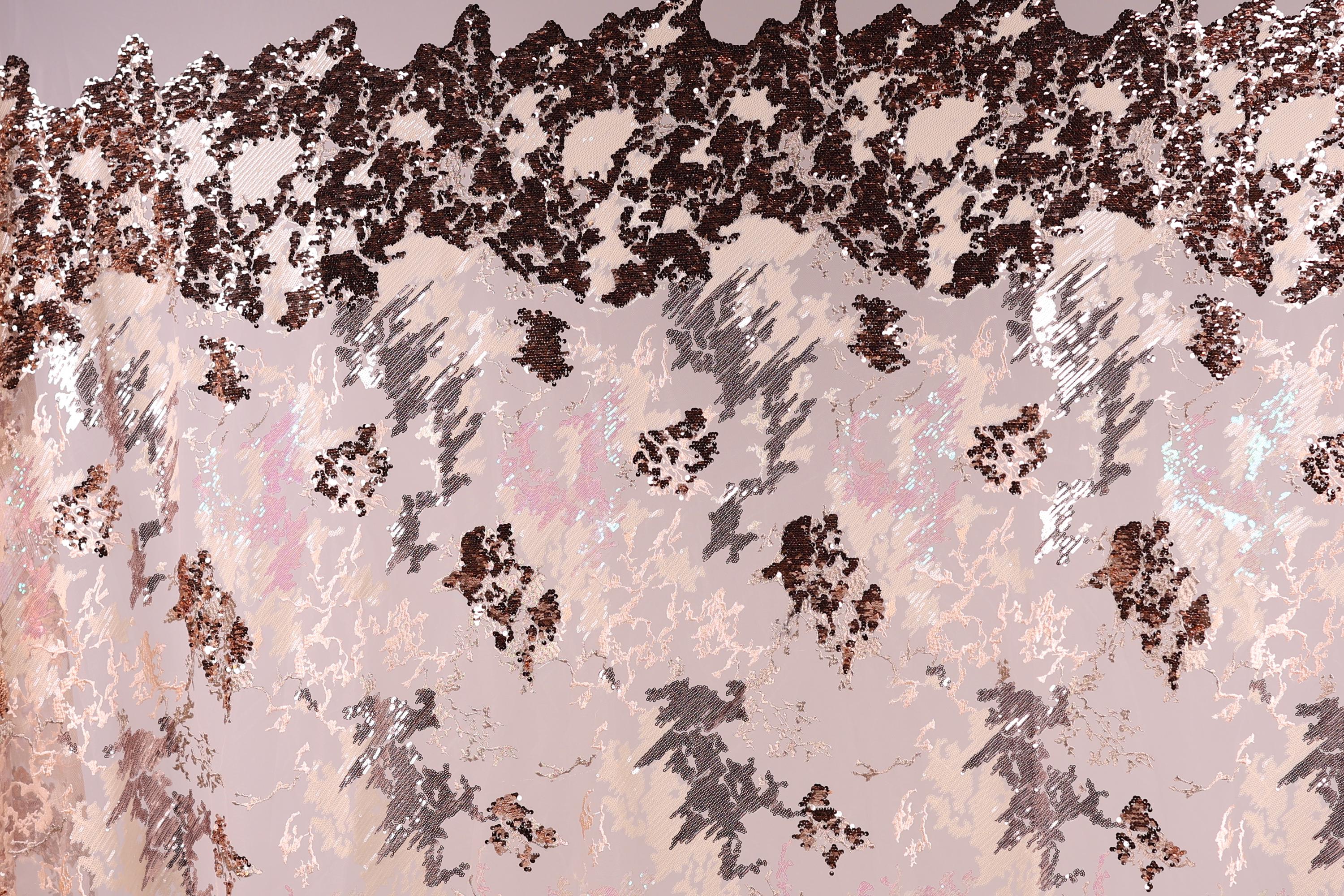 The image is a collage of various textures and patterns, including a mix of pink, black, and white colors. The collage appears to be a creative and artistic representation of different elements coming together to form a visually interesting composition.