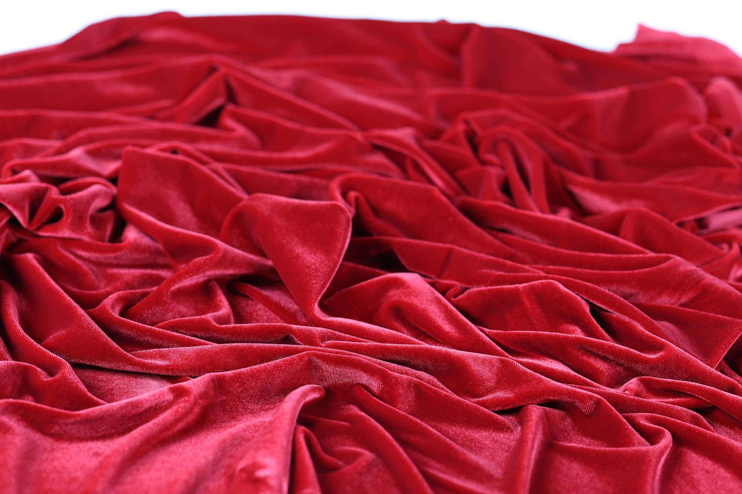 a close-up view of a crumpled, red velvet fabric.
