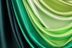 a close-up view of a fabric with a gradient of green and black colors, creating a visually striking and vibrant pattern.