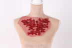 A mannequin with a red floral embroidered patch on its chest.