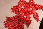 a close up of a pillow with red sequins on it