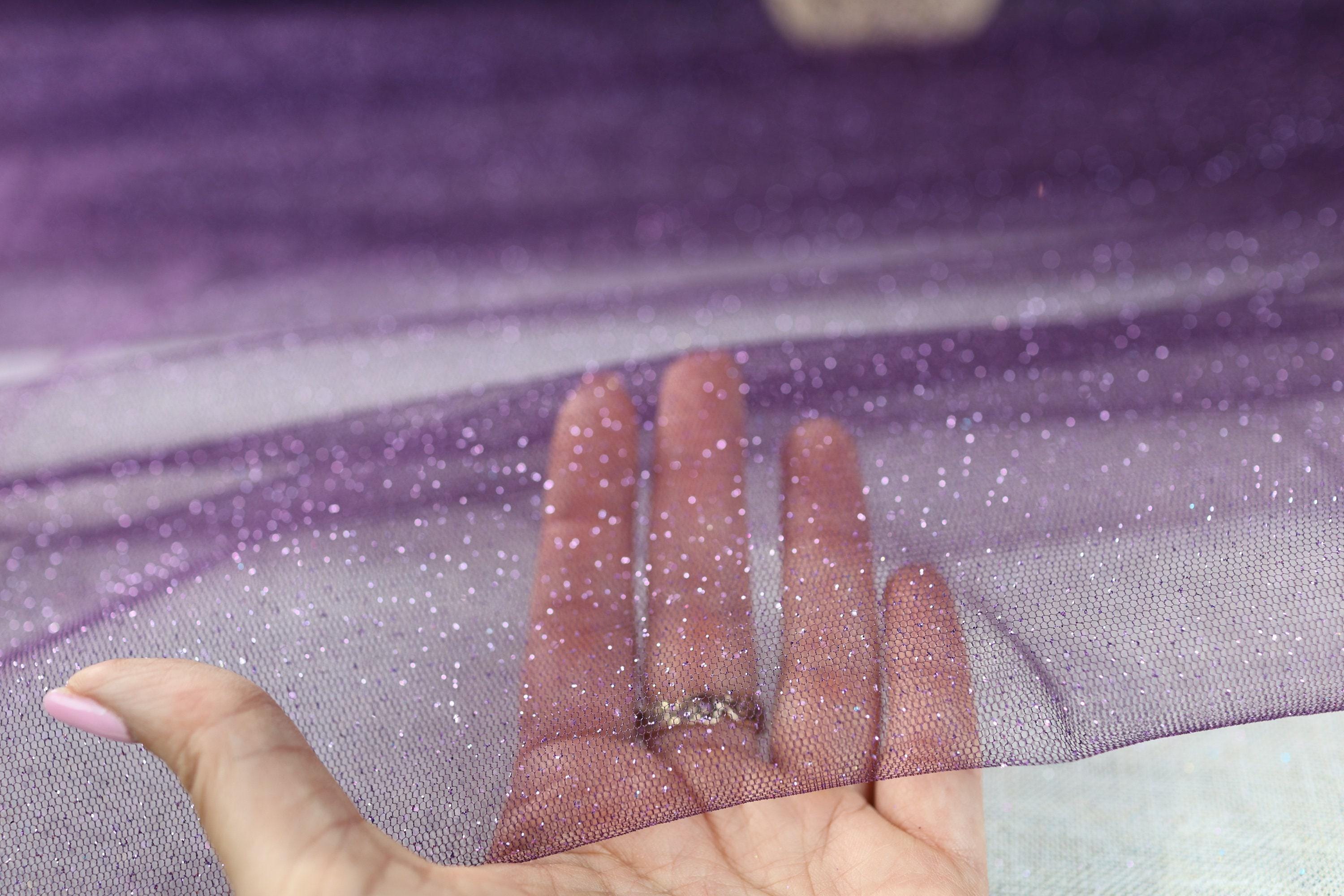 a person's hand with a diamond ring on it