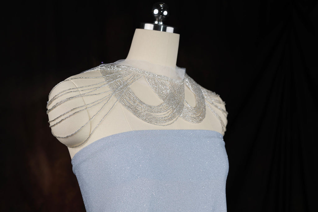 a white and blue dress on a mannequin