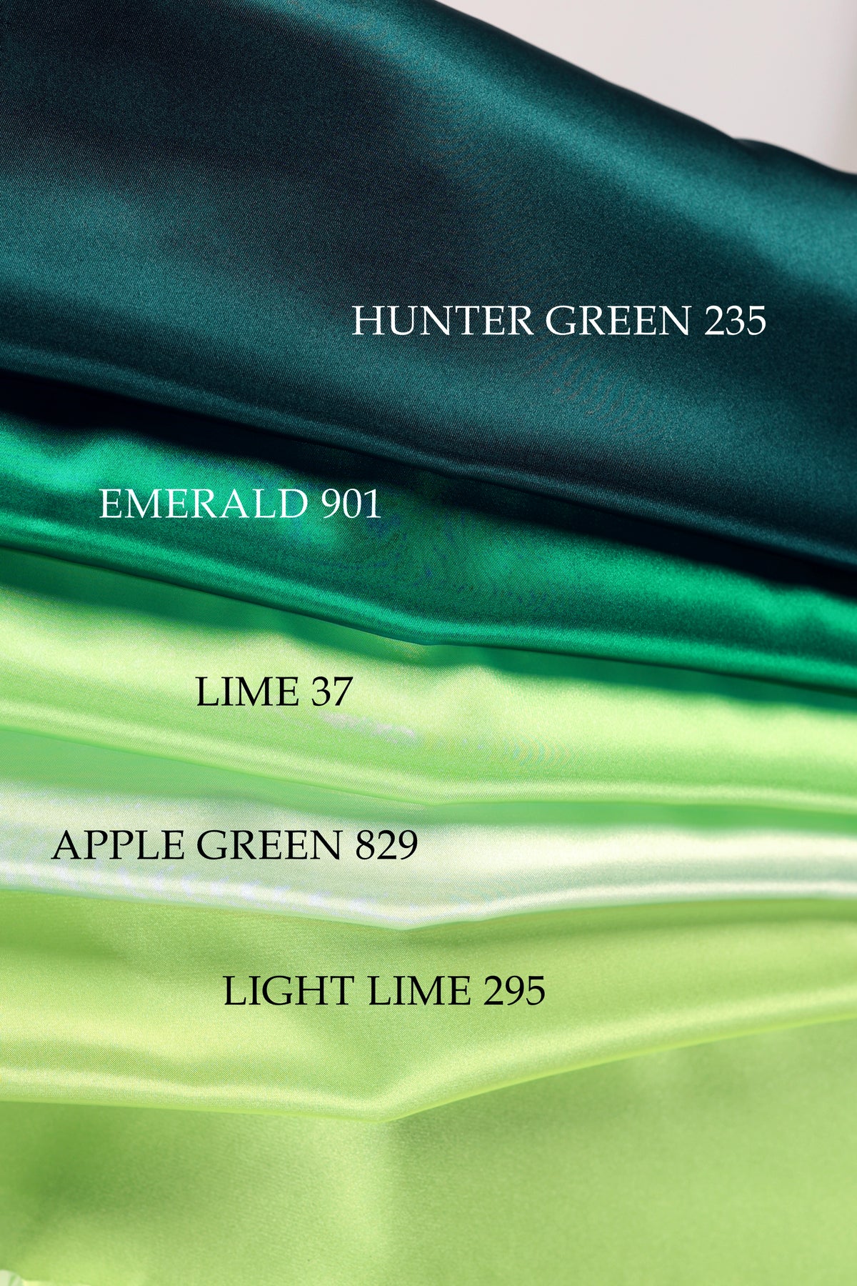 The image is a close-up of a fabric with four different shades of green, including a dark green, a lighter green, a lime green, and a light lime green.