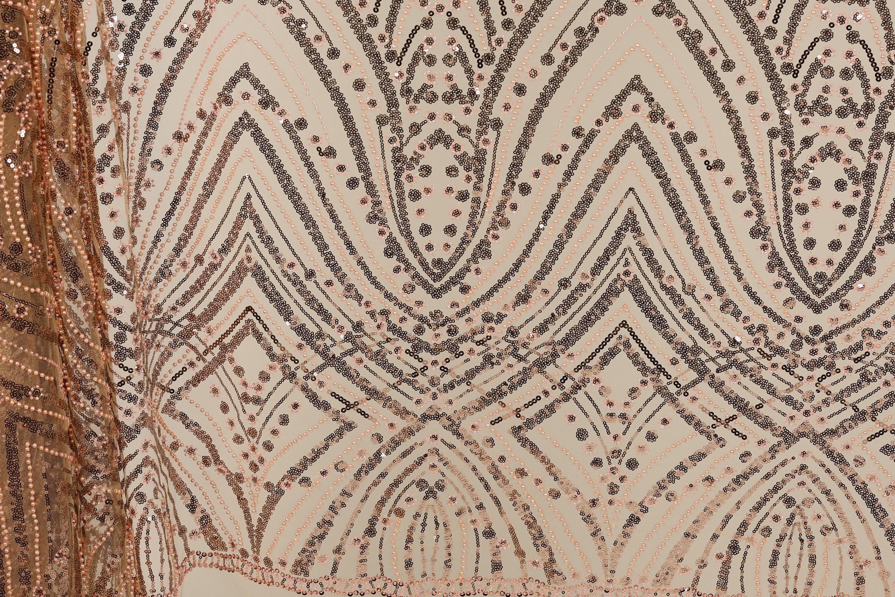 a close-up view of a fabric with a repeating pattern of diamond shapes and small dots in shades of brown and beige. The pattern is intricate and visually striking, with the diamonds and dots creating a sense of depth and texture.