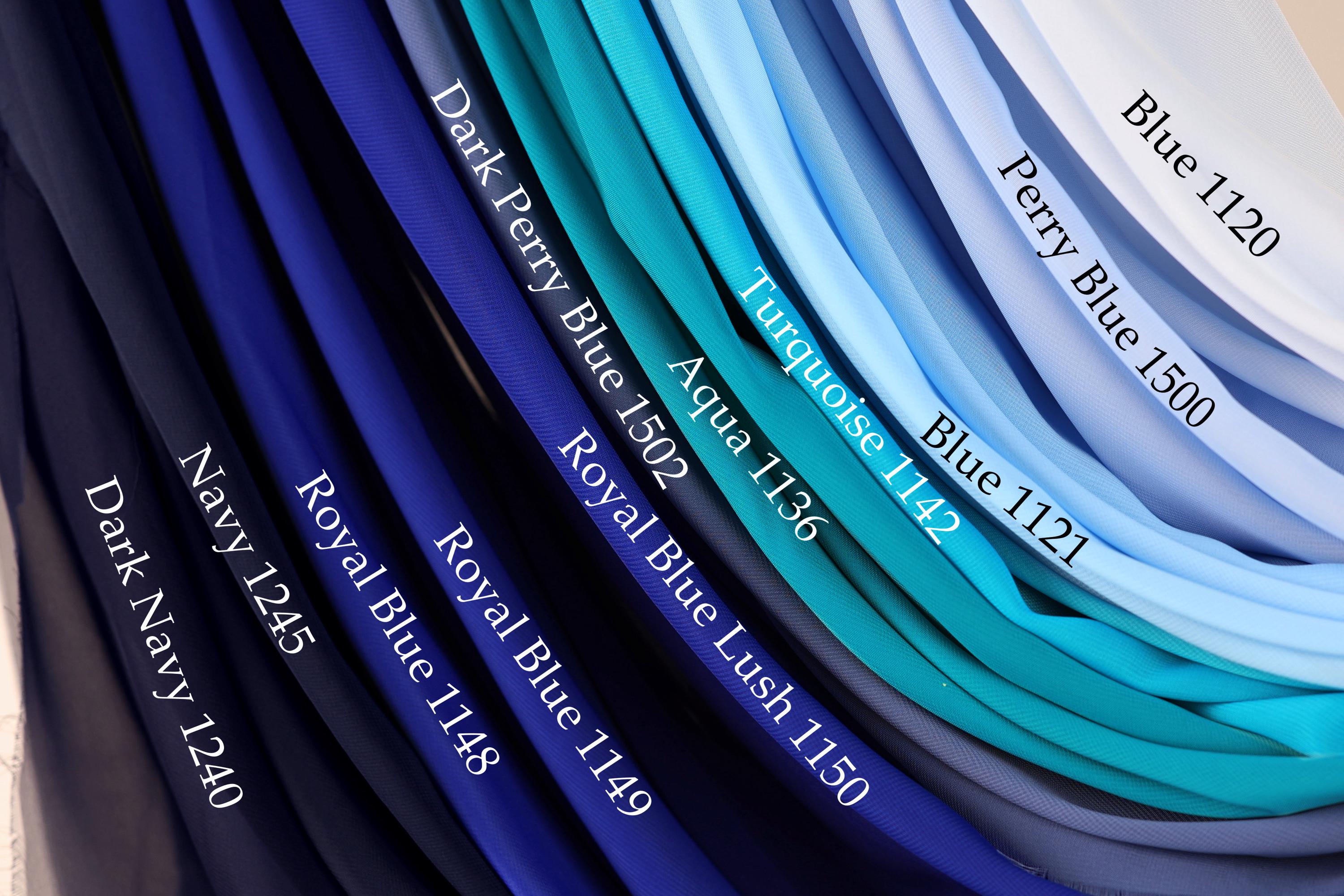 a collection of fabric swatches in various shades of blue, including navy, royal blue, turquoise, aqua, and light blue.
