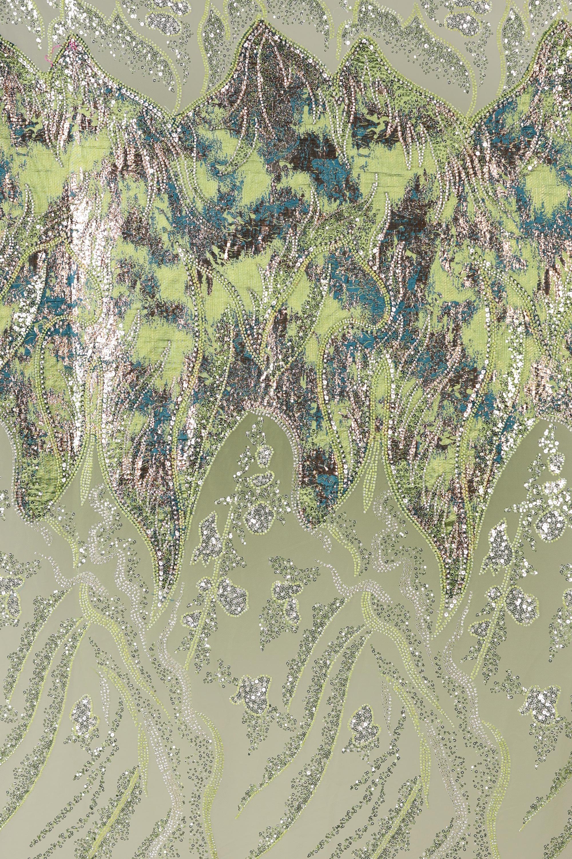 The image is a collage of various images, featuring a pattern of green and brown hues with intricate designs and textures. The overall composition is visually striking and captivating.