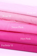A stack of five fabric swatches in various shades of pink, including Rose 10, Neon Pink, Hot Pink, and Fuchsia 11.