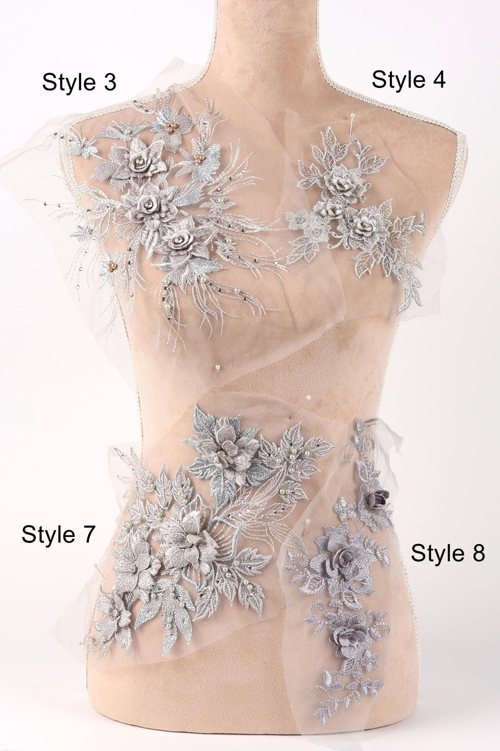 A mannequin with various decorative floral and leaf-like embellishments on its bust and hips, each labeled with a different style number.