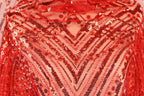 a close-up view of a red sequin fabric with a geometric pattern.