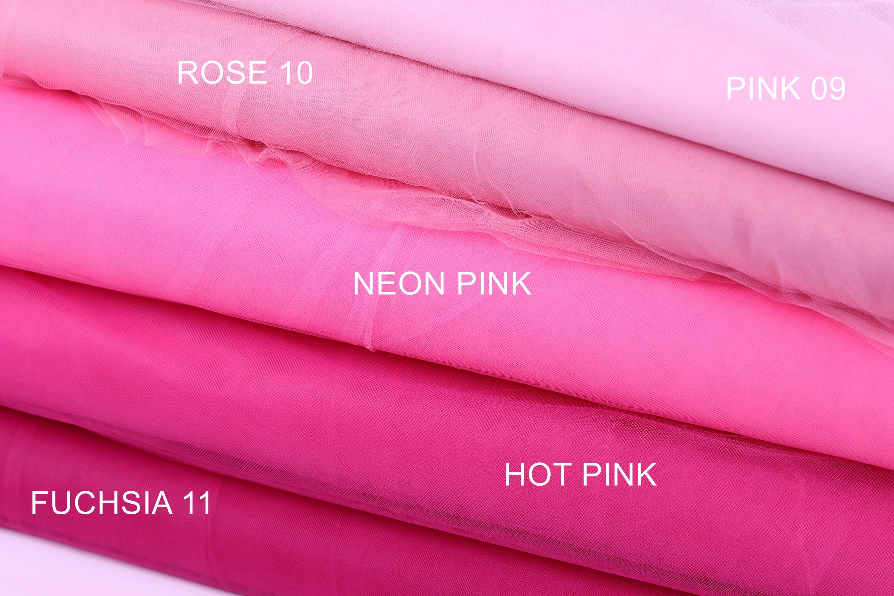 A close-up image of various colored tulle fabrics, including pink, neon pink, hot pink, and rose, with labels indicating the color and type of fabric.