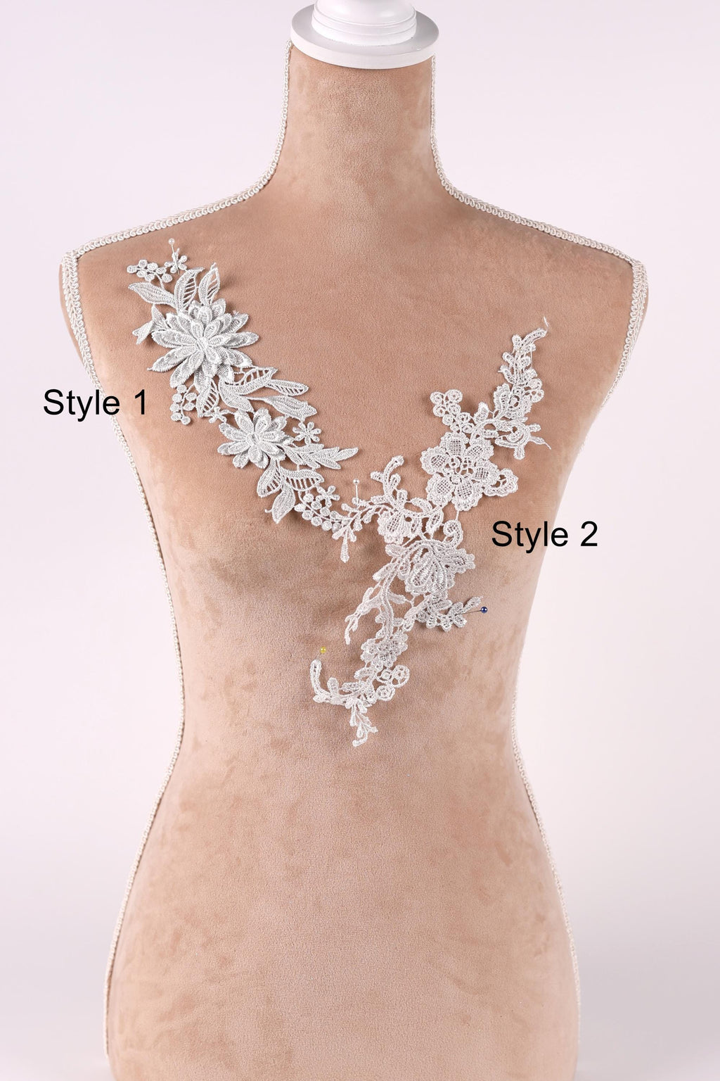 A mannequin wearing a white lace vest with floral designs, labeled as "Style 1" and "Style 2".
