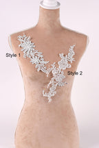 A mannequin wearing a white lace vest with floral designs, labeled as "Style 1" and "Style 2".