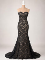 A black lace evening gown with a sweetheart neckline and a long train, displayed on a mannequin.