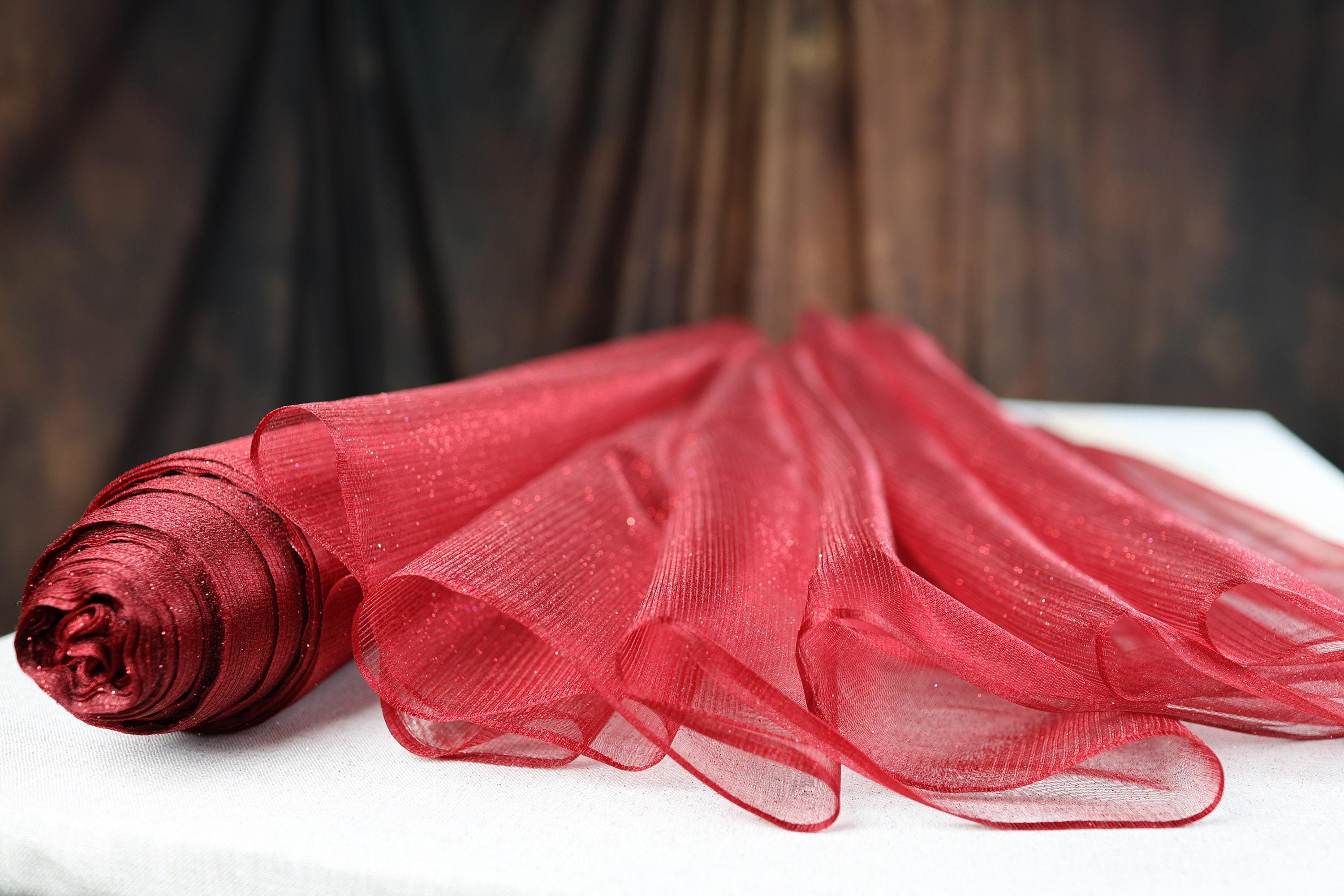 a red piece of cloth sitting on top of a table