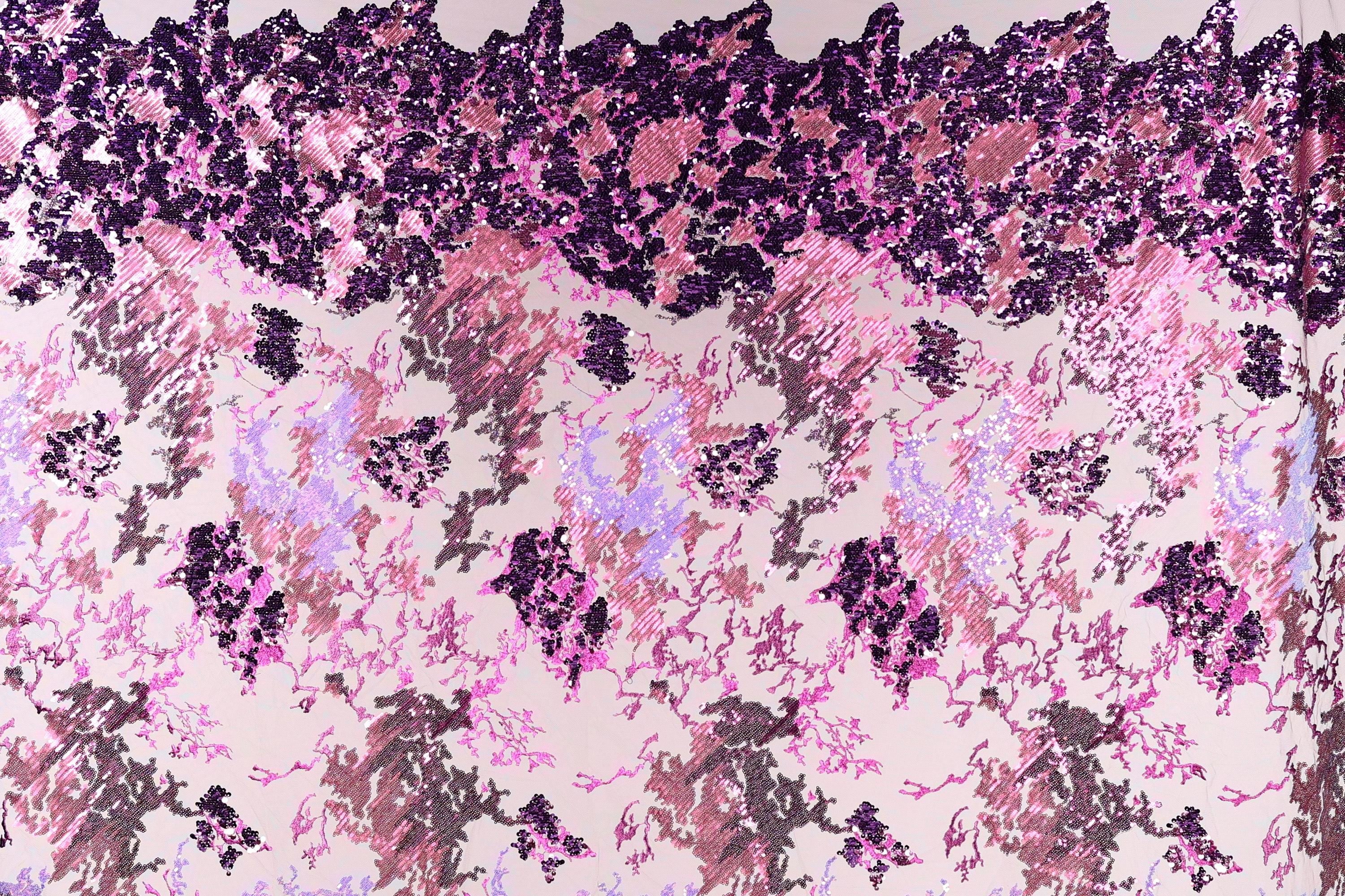 The image is a collage of various images, featuring a pattern of pink and purple sequins or sequin-like textures. The pattern is composed of different shapes and sizes of sequins, creating a visually striking and intricate design.