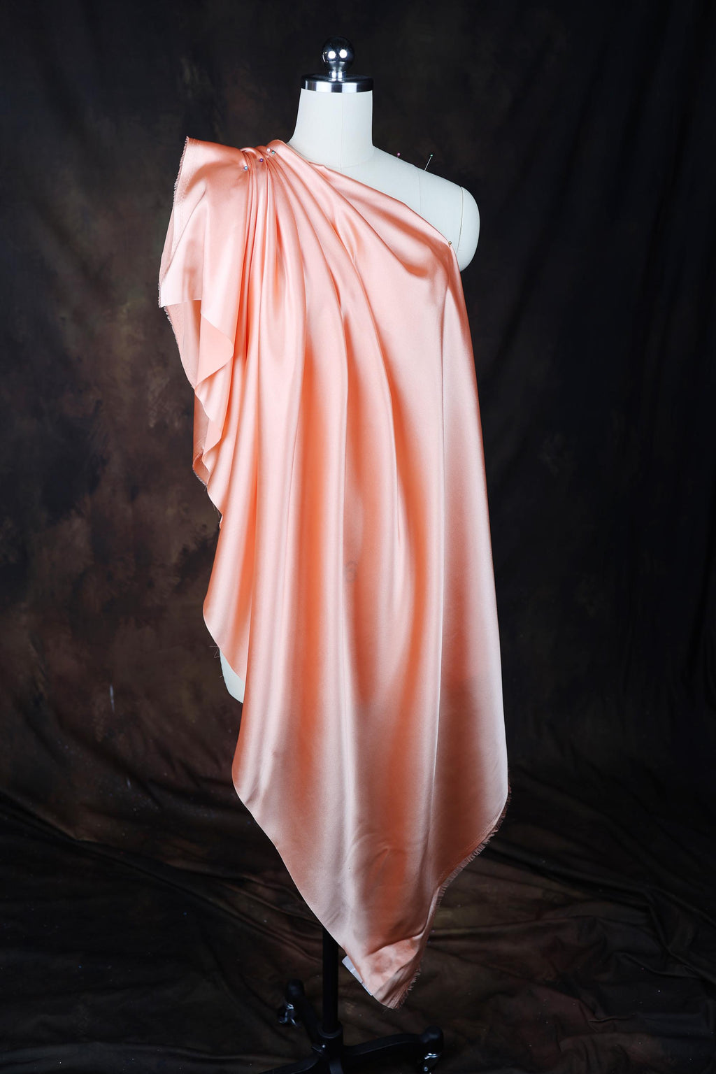 a dress on a mannequin on a black background