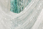 a close-up view of a white fabric with sequin patterns, creating a visually striking and intricate design.