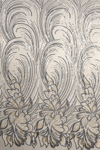 a repeating pattern of black and white floral designs on a light-colored background.