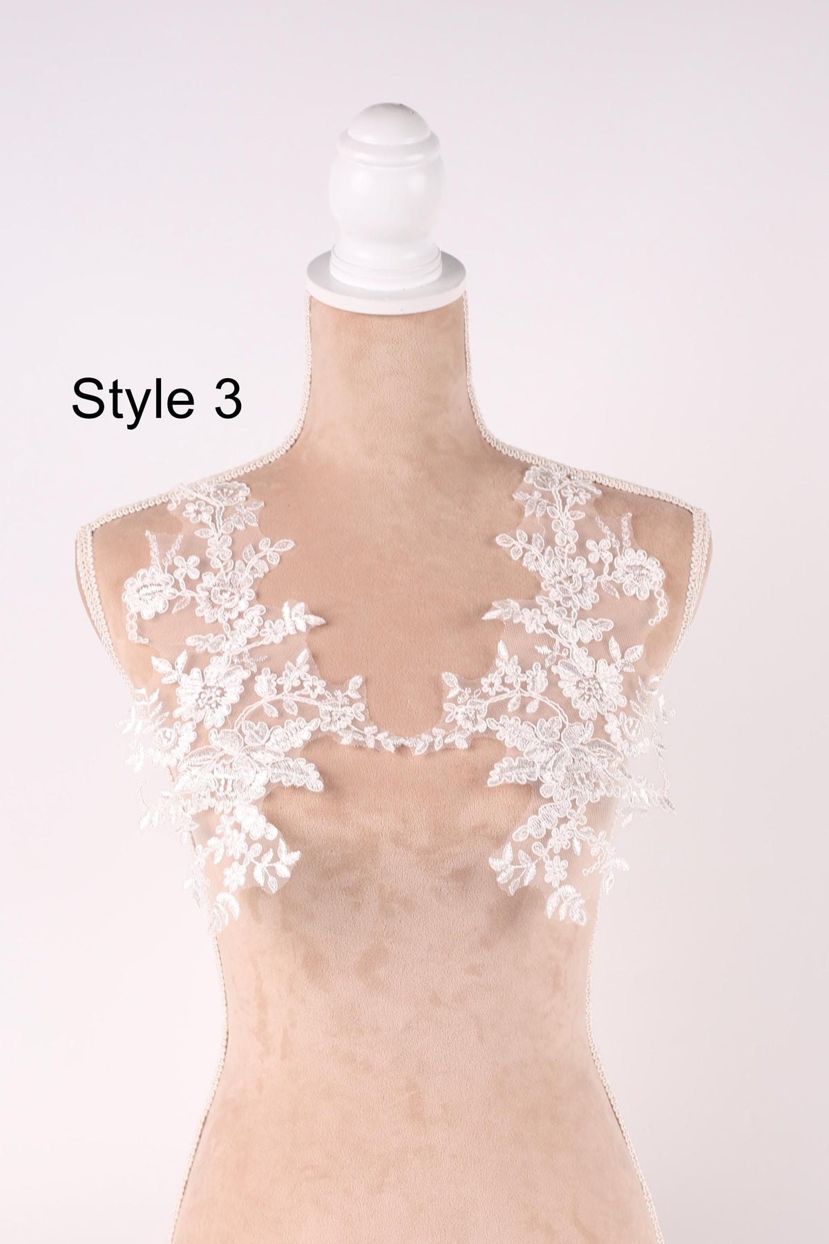 A mannequin with a white lace bodice and floral lace details on the bust area, labeled as "Style 3".