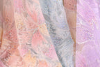 a close-up view of a fabric with a floral pattern, showcasing the intricate details and textures of the material.