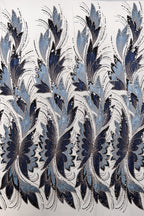 a repeating pattern of blue and white floral designs on a white background.