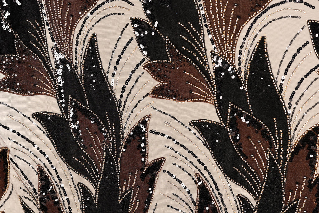 a close-up view of a fabric with a striking pattern of brown and black sequins and beads, creating a visually captivating and intricate design.