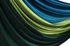 a close-up view of a fabric with a shiny, glittery texture in shades of blue and green.