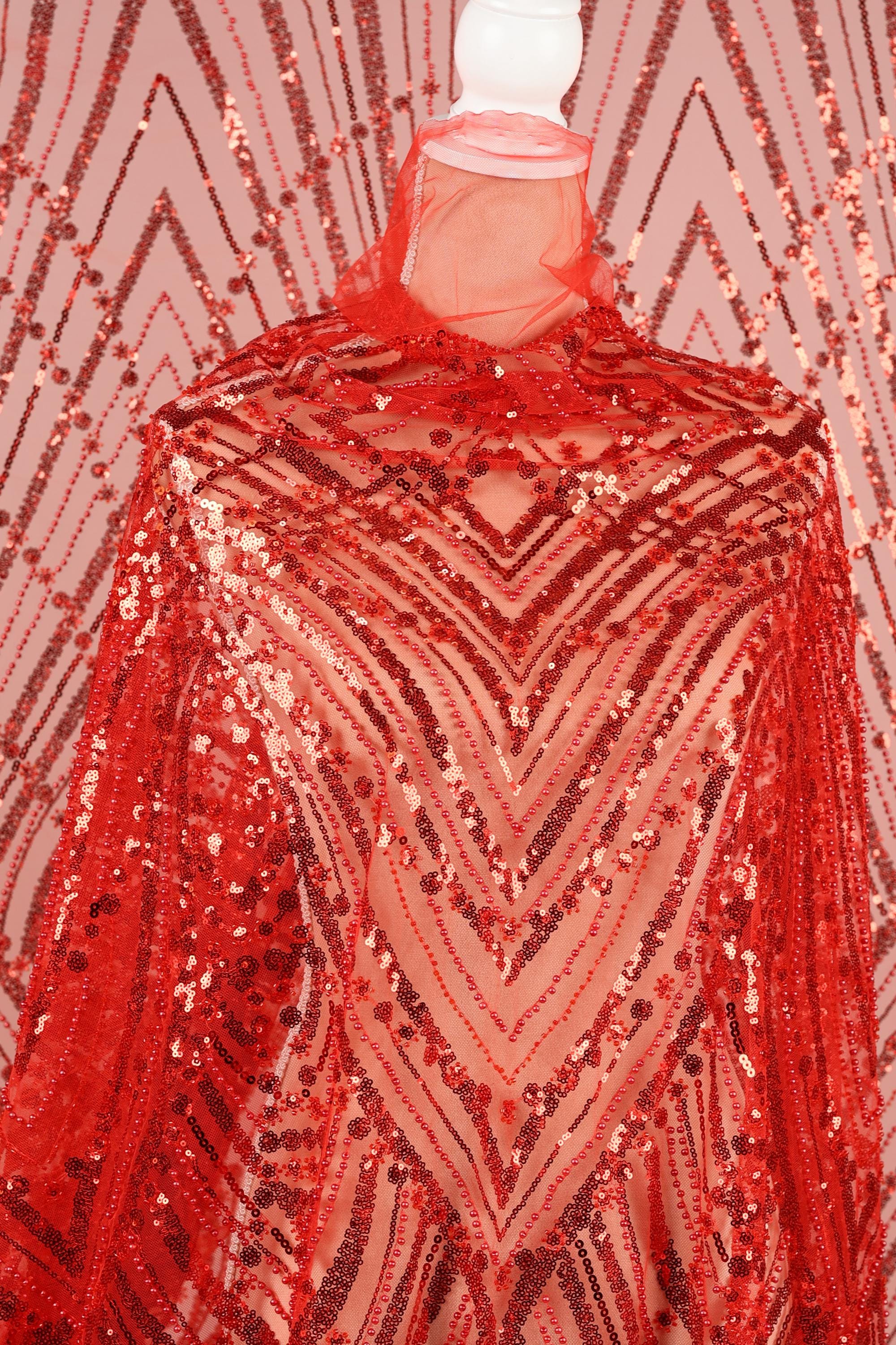 a red sequin fabric with a geometric pattern, creating a visually striking and eye-catching design.