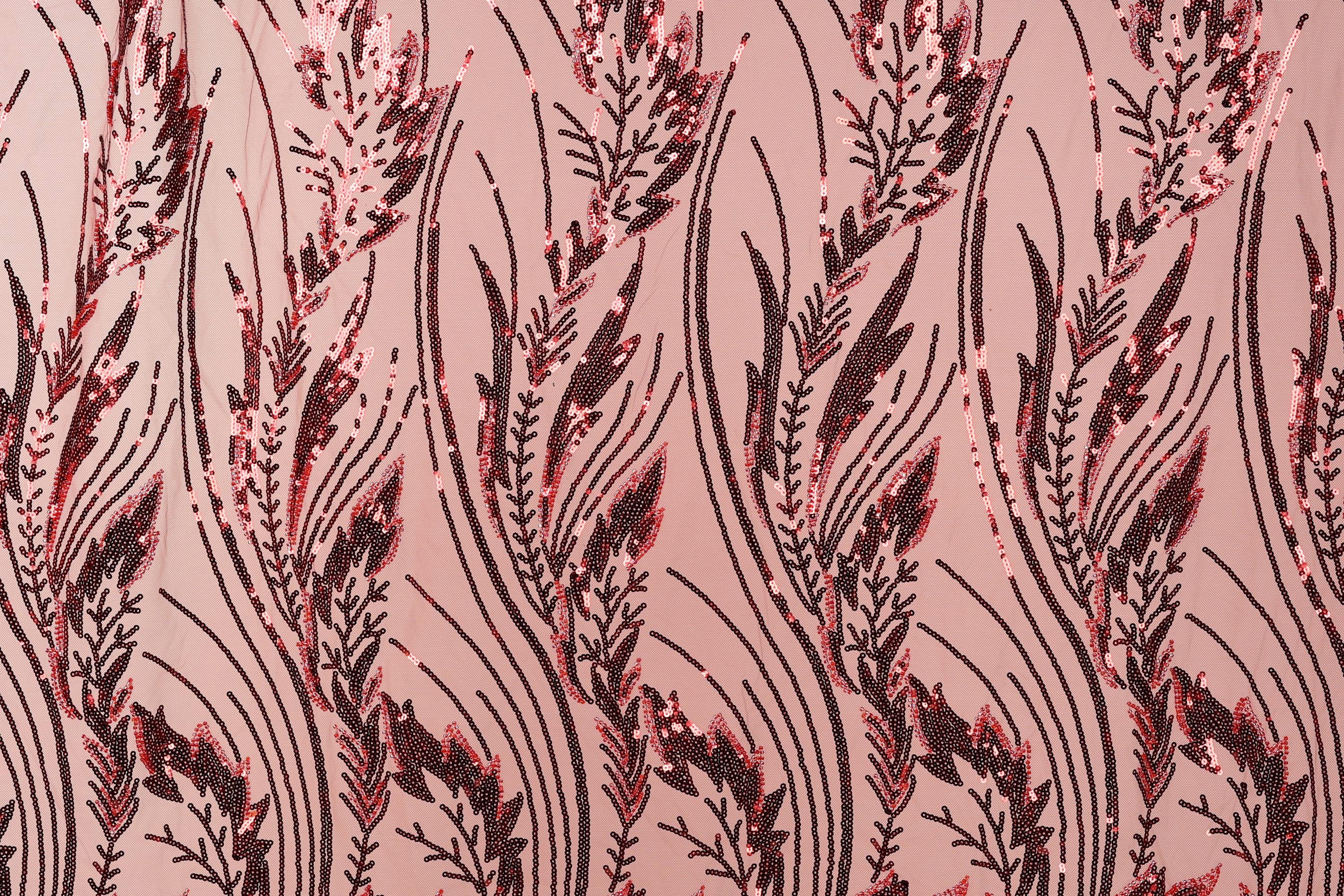 a close-up view of a fabric with a repeating pattern of red and black sequin designs. The pattern consists of stylized leaves and stems, creating a visually striking and intricate design.